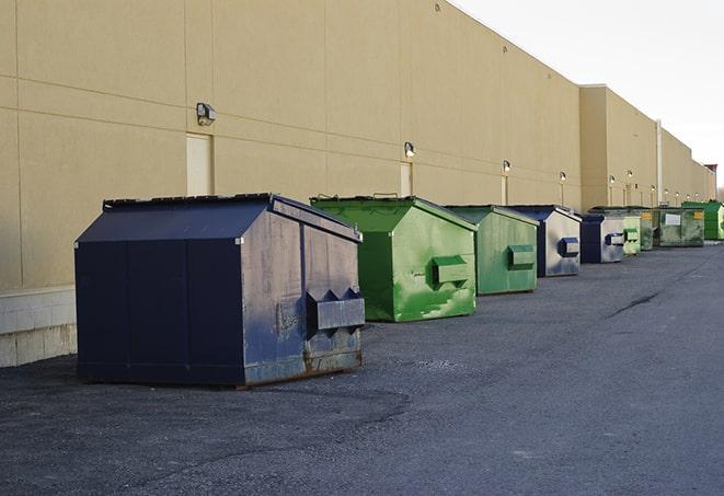 conveniently located dumpsters for construction workers use in Brownsville